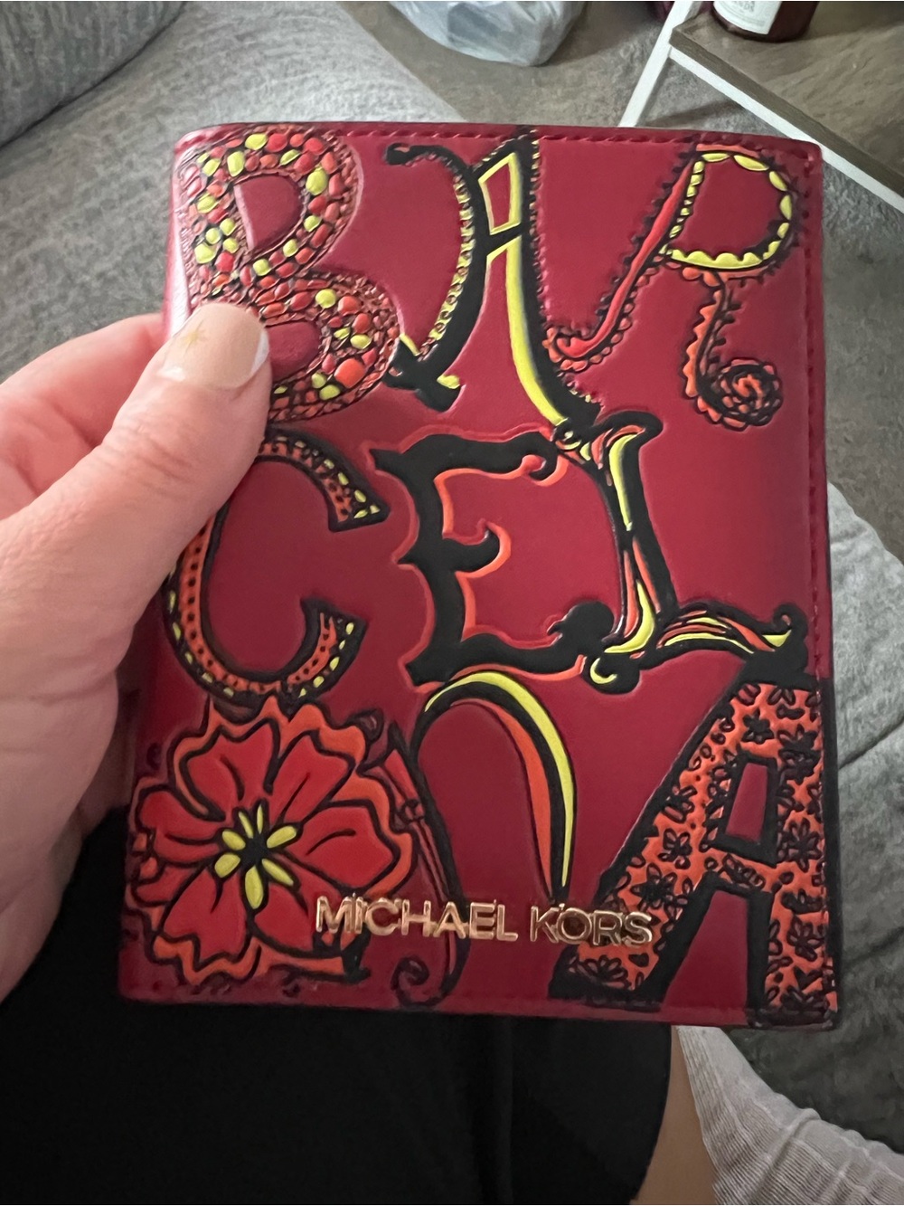 Michael Kors Red Floral Embossed Passport Holder with Yellow and Black Accents